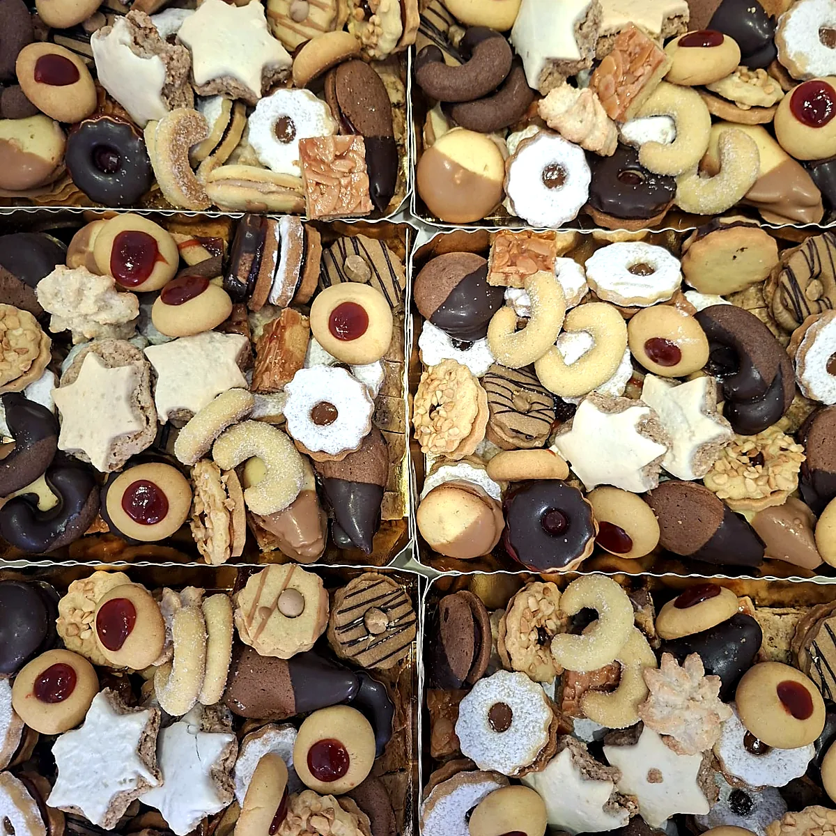 Weihnachtsgebäck in Schachteln: Zimtsterne, Spitzbuben und Nussecken